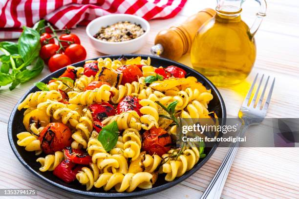 fresh healthy pasta salad on white table. - primavera stock pictures, royalty-free photos & images