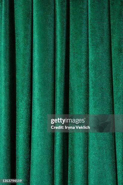 concept of trendy background  for christmas and new year holiday  with green velvet curtains. - green curtain stock pictures, royalty-free photos & images