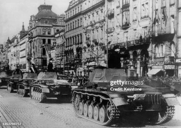 German Wehrmacht motorised column of Panzerkampfwagen II light tanks parade through Wenceslas Square following the invasion and occupation of...