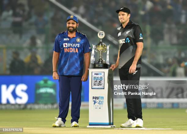 Tim Southee, of New Zealand and Rohit Sharma of India pose for a picture next to the series trophy prior to the T20 International Match between India...