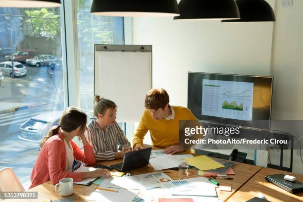 businessman and businesswoman working in board room - planalto stock pictures, royalty-free photos & images