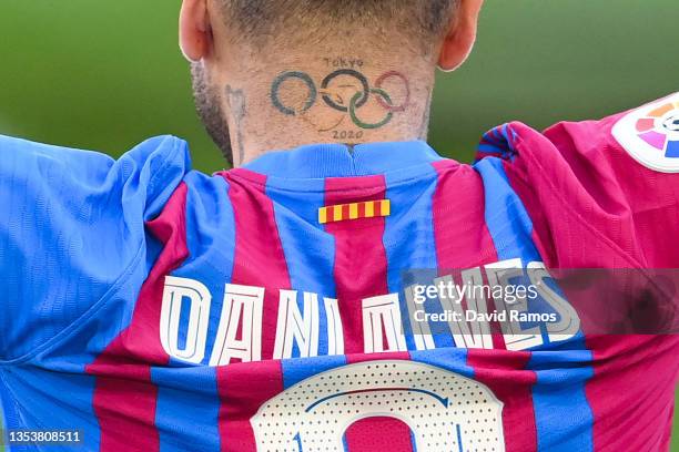 Tattoo of the Olympic ring is seen on Dani Alves as he is presented as a FC Barcelona player at Camp Nou on November 17, 2021 in Barcelona, Spain.