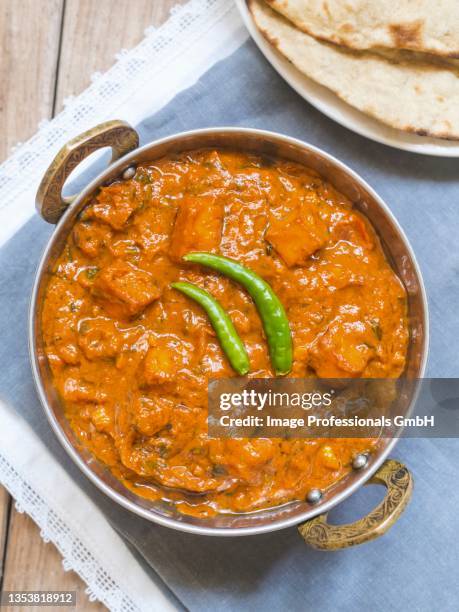 paneer tikka masala in a traditional copper bowl (india) - paneer tikka stock pictures, royalty-free photos & images