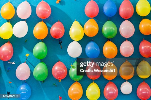 Germany, Bavaria, Munich, Multi coloured balloons and dart at Beer Fest Germany, Bavaria, Munich, Multi coloured balloons and dart at Beer Fest