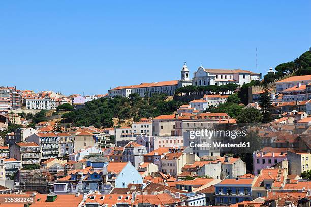 europe, portugal, lisbon, alfama, view of city with mosteiro nossa senhora da graca monastery and church - graca church stock pictures, royalty-free photos & images