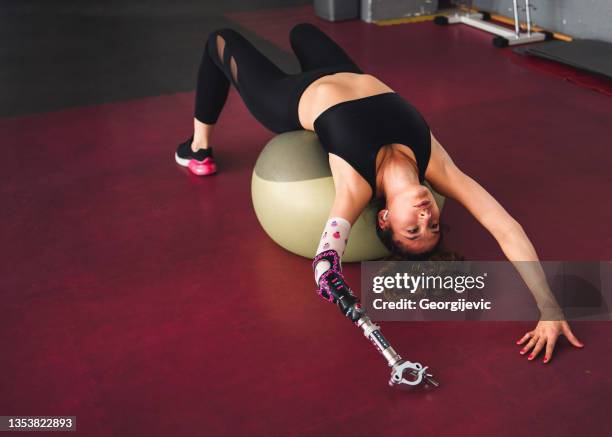 disabled woman in gym - arms of steel stock pictures, royalty-free photos & images