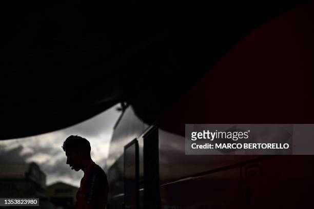 Grenadiers' Colombian rider Egan Bernal is silhouetted as he cycles on a home-trainer bicycle outside his team's bus, in Bilbao, northern Spain, on...