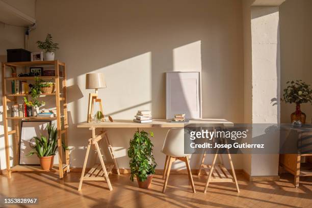 desktop for home office made by timber and sawhorses in a nordic style apartment. mockup frame empty copy space - feng shui house stock pictures, royalty-free photos & images