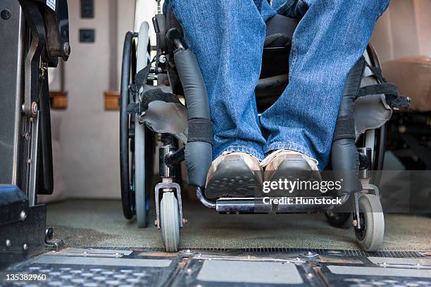 low section view of a man with a spinal cord injury exiting his accessible van - förlamning bildbanksfoton och bilder