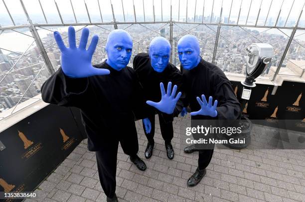 Blue Man Group celebrates their 30th anniversary at the Empire State Building on November 17, 2021 in New York City.