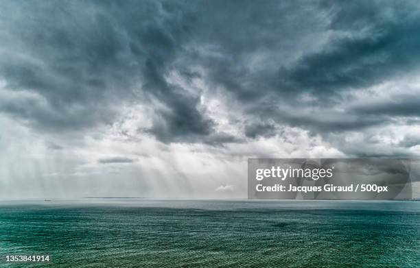 scenic view of sea against cloudy sky,tanjung bungah,pulau pinang,malaysia - dramatic sky sea stock pictures, royalty-free photos & images