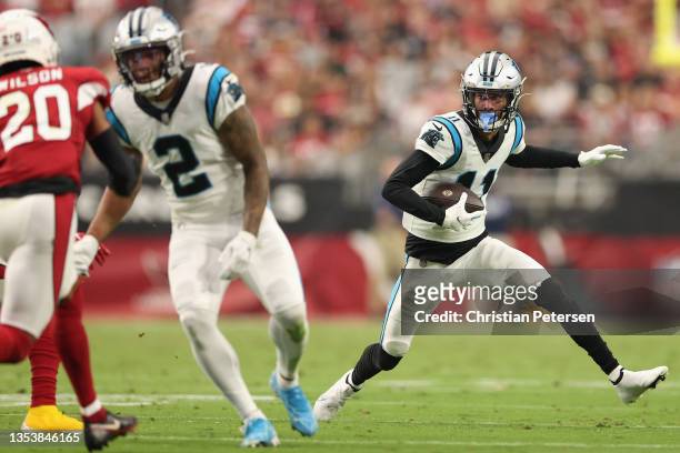 Wide receiver Robby Anderson of the Carolina Panthers runs with the football after a reception against the Arizona Cardinals during the NFL game at...