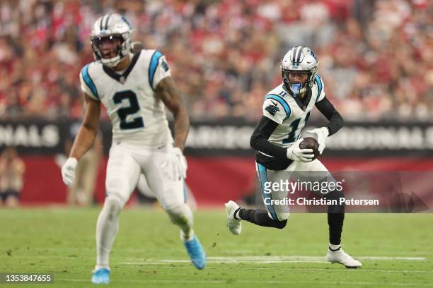 Wide receiver Robby Anderson of the Carolina Panthers runs with the football after a reception against the Arizona Cardinals during the NFL game at...