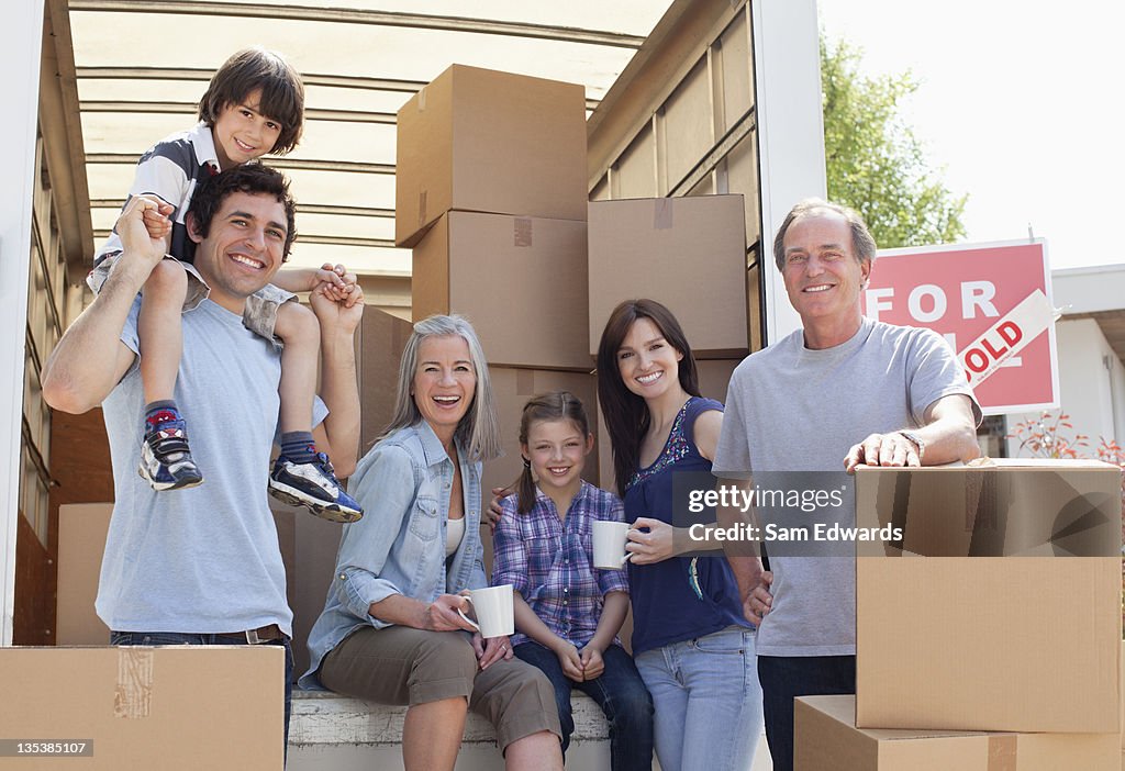 Family taking break near moving van