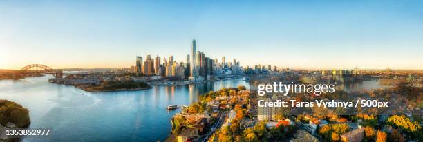 aerial view of city at waterfront during sunset,sydney,new south wales,australia - barangaroo stock pictures, royalty-free photos & images