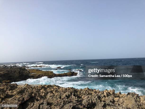 scenic view of sea against clear sky,aruba - samantha lee stock pictures, royalty-free photos & images