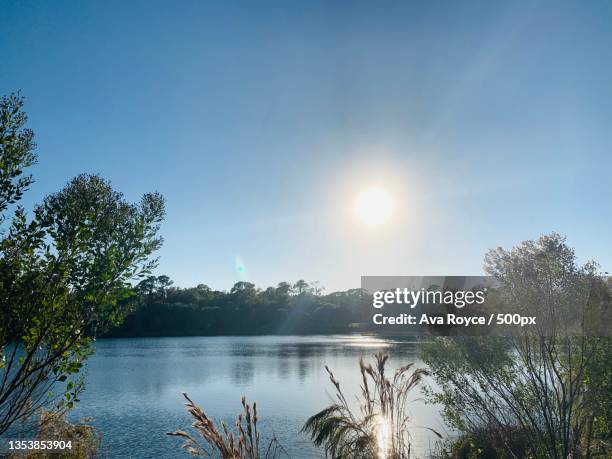 scenic view of lake against sky - ava hardy stock pictures, royalty-free photos & images