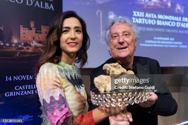 Caterina Balivo and Enzo Iachetti near a Truffle sold for 100,000 euros during the 21st World Alba white truffle charity auction at Grinzane Cavour...