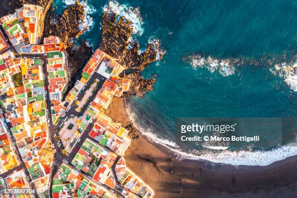 aerial view of colorful houses on headland, tenerife, spain - puerto de la cruz tenerife stock pictures, royalty-free photos & images