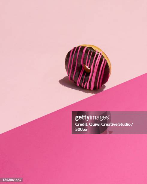 chocolate glazed pink donut food gravity,guadalajara,jalisco,mexico - spinning top stock pictures, royalty-free photos & images