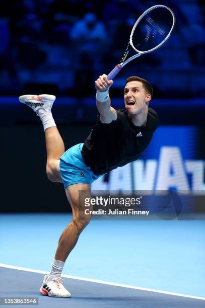 Joe Salisbury of Great Britain plays a backhand during his Mens Doubles Round Robin match against Pierre-Hugues Herbert of France and Nicolas Mahut...