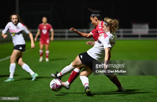 Izzy Collins of Lewes battles for the ball with Simran Jhamat of Bristol City during the FA Women's Continental Tyres League Cup match between...