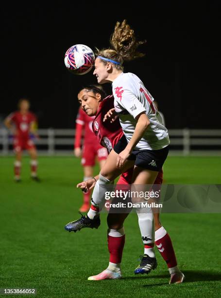 Izzy Collins of Lewes battles for the ball with Simran Jhamat of Bristol City during the FA Women's Continental Tyres League Cup match between...