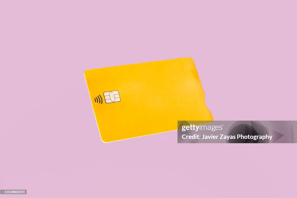 Yellow Credit Card On Pink Background