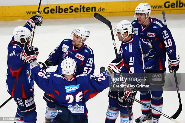 Ronny Arendt of Mannheim celebrates his team's second goal with team mates during the DEL match between Adler Mannheim and Hannover Scorpions at SAP...