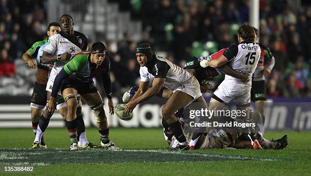 Thierry Dusautoir of Toulouse passes the ball during the Heineken Cup match between Harlequins and Toulouse at Twickenham Stoop on December 9, 2011...