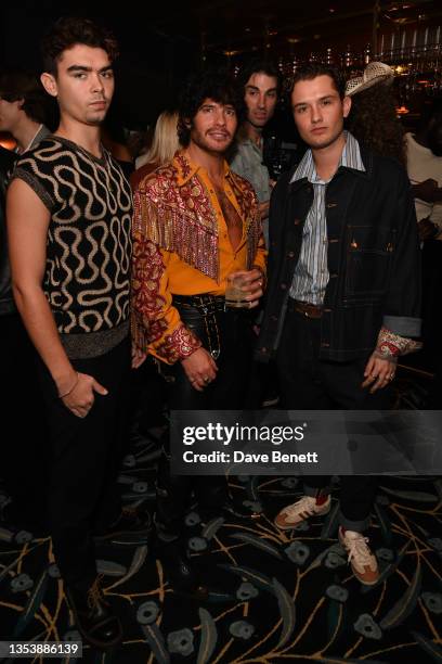 Rudy Law, Luke Day and Rafferty Law attend the GQ Style AW21 issue launch party at NoMad London on November 17, 2021 in London, England.