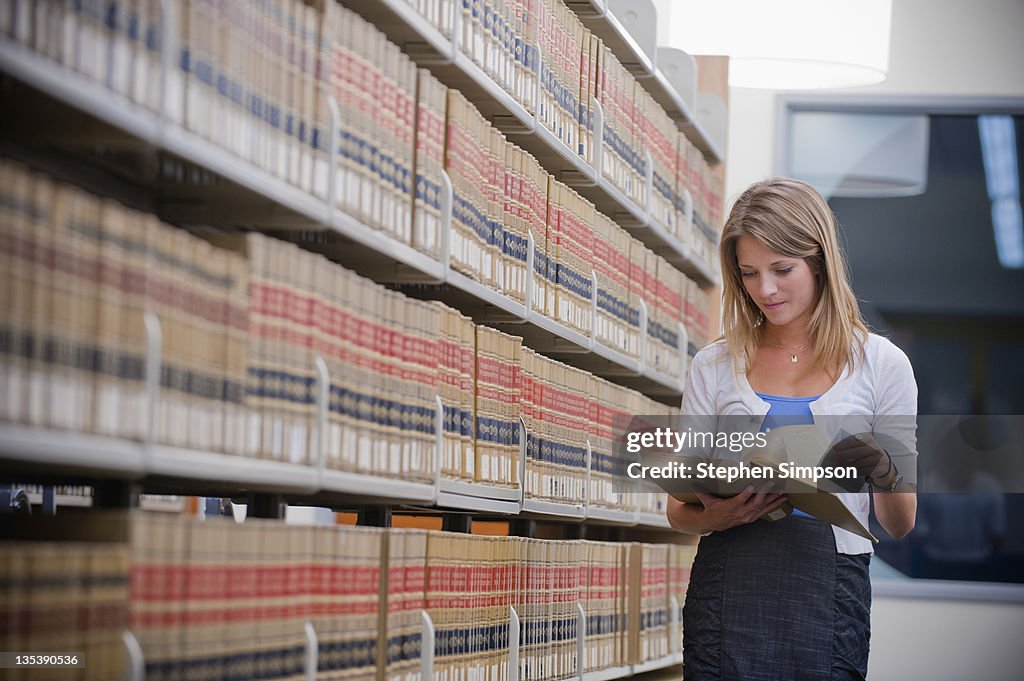 Young businesswoman in law library