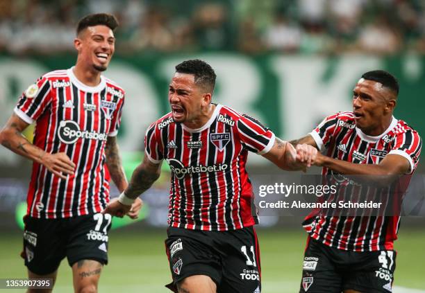 Luciano of Sao Paulo celebrates with his team mates after scoring the second goal for their team during a match between Palmeiras and Sao Paulo as...