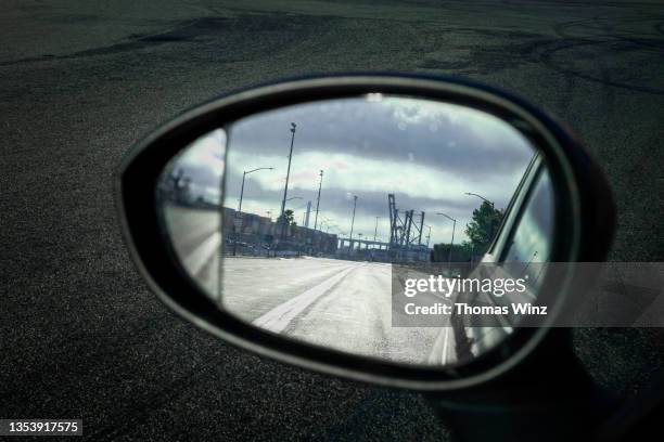 industrial landscape in a rear view mirror - rear view mirror stock pictures, royalty-free photos & images