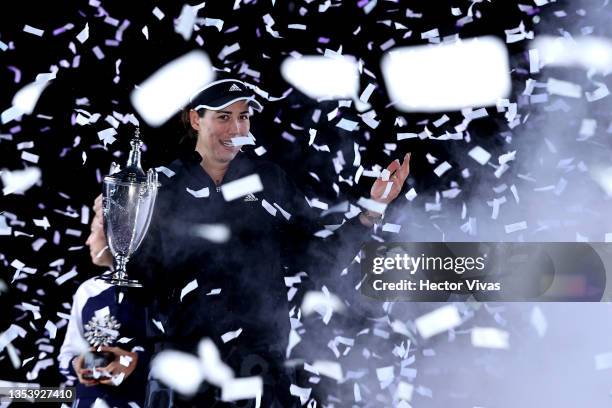 Garbiñe Muguruza of Spain poses with the Billie Jean King trophy after defeating Anett Kontaveit of Estonia in Women's Singles final match during Day...