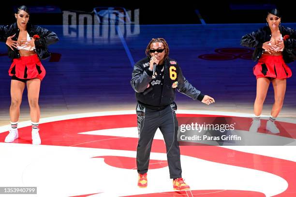 Rapper Gunna performs at halftime during the Boston Celtics v Atlanta Hawks game at State Farm Arena on November 17, 2021 in Atlanta, Georgia.