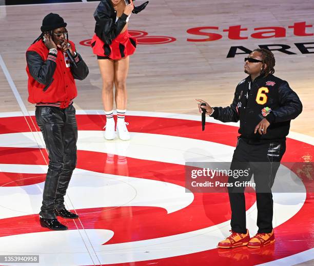 Young Thug and Gunna perform at halftime during the Boston Celtics v Atlanta Hawks game at State Farm Arena on November 17, 2021 in Atlanta, Georgia.