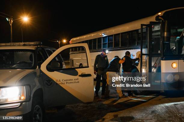 Texas state trooper and border patrol officer inspect a migrant involved in a smuggling case on November 17, 2021 in La Joya, Texas. The number of...