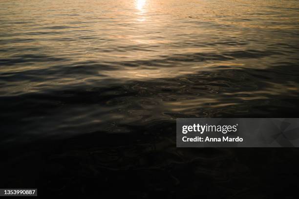 close up of water during sunset - venice italy canal stock pictures, royalty-free photos & images