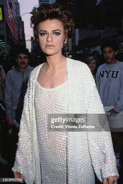 American actress and comedian Sandra Bernhard, wearing a white minidress, attends a screening party for 'Without You I'm Nothing' held at Time Cafe...