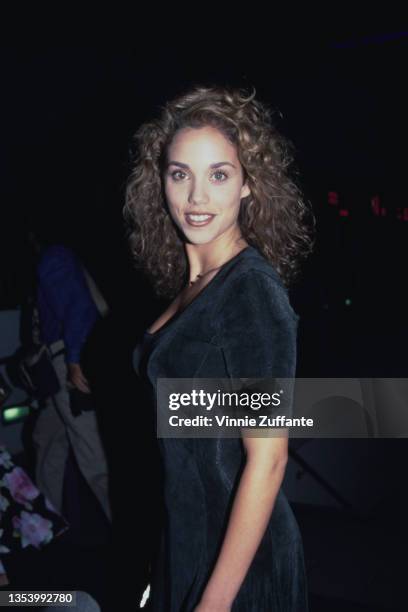 American actor Elizabeth Berkley, wearing a black outfit, attends the Hollywood premiere of 'Amongst Friends' held at the Galaxy Theatre in Los...