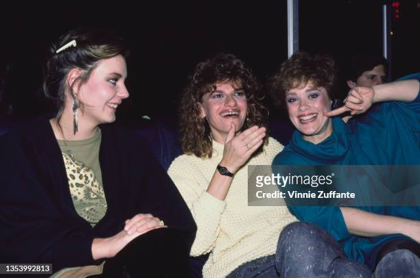 Maria Burton, American actress and comedian Sandra Bernhard, and American actress Donna Pescow laughing together at an event, United States, circa...