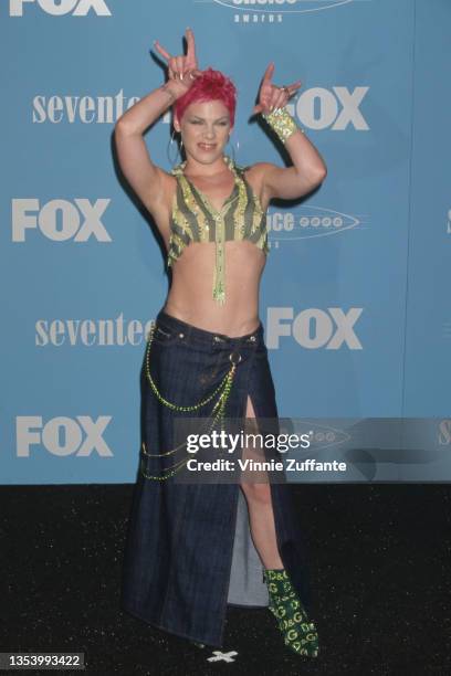 American singer Pink, with pink hair, attends the 2nd Annual Teen Choice Awards, held at the Barker Hangar at Santa Monica Air Center in Santa...