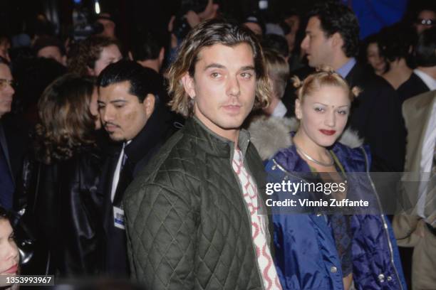 British singer, songwriter and guitarist Gavin Rossdale, wearing a quilted jacket, and American singer Gwen Stefani, wearing a blue Tommy Hilfiger...