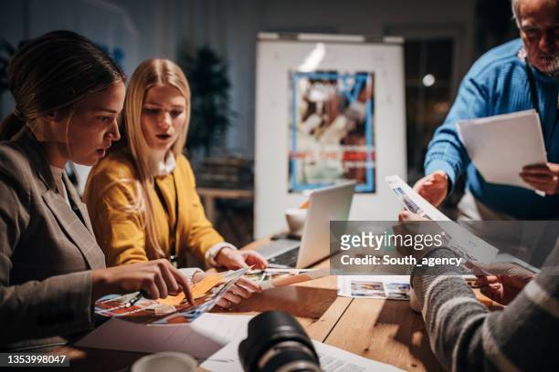 journalists on late meeting - journalist stock pictures, royalty-free photos & images
