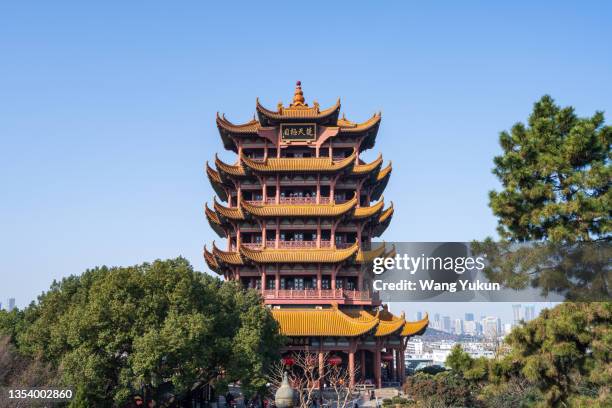 yellow crane tower, a landmark building in wuhan, china - wuhan city stock-fotos und bilder