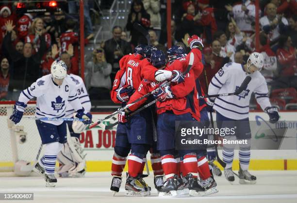 Dennis Wideman of the Washington Capitals celebrates his power play goal at 12:33 of the first period against the Toronto Maple Leafs at the Verizon...