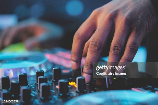 close-up view of modern electrical sound mixer console during concert. - dj stock-fotos und bilder