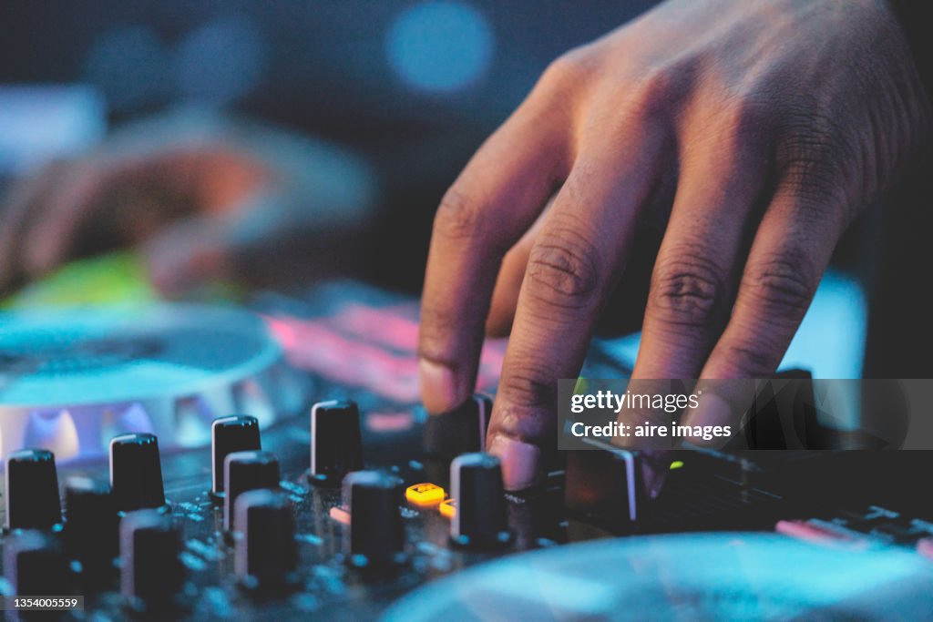 Close-up view of modern electrical sound mixer console during concert.