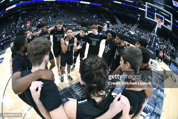 The Dartmouth Big Green lhuddle before during a college basketball game against the Georgetown Hoyas at the Capital One Arena on November 13, 2021 in...